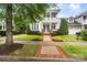 Charming two-story home featuring a welcoming porch and beautifully landscaped front yard at 5663 Morris Hunt Dr, Fort Mill, SC 29708