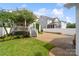 Charming home exterior with lush landscaping, well-manicured lawn, and a spacious driveway at 5663 Morris Hunt Dr, Fort Mill, SC 29708