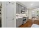 Modern kitchen featuring stainless steel appliances, white countertops, and stylish gray cabinets at 5663 Morris Hunt Dr, Fort Mill, SC 29708