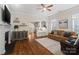 Open-concept living room with fireplace, seamlessly connecting to the modern kitchen at 5663 Morris Hunt Dr, Fort Mill, SC 29708