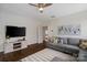Inviting living room with stylish furnishings, a flat-screen TV, and hardwood flooring at 5663 Morris Hunt Dr, Fort Mill, SC 29708
