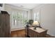 Cozy office features a large window with shutters and a wooden desk and cabinet at 5663 Morris Hunt Dr, Fort Mill, SC 29708