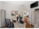 This office features wood floors and built-in cabinets, and a view to the kitchen at 5663 Morris Hunt Dr, Fort Mill, SC 29708