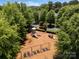 Community playground with swings, slides, and play equipment, surrounded by trees and lush greenery at 5663 Morris Hunt Dr, Fort Mill, SC 29708