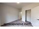 New bedroom featuring neutral paint and carpet with a closet and white doors at 601 Queens Rd, Gastonia, NC 28052