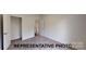 New bedroom featuring neutral paint and carpet with a closet and white doors at 601 Queens Rd, Gastonia, NC 28052