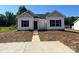 Charming single-story home with a symmetrical design and a well-manicured front lawn at 601 Queens Rd, Gastonia, NC 28052