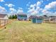 Expansive fenced backyard with shed, offering ample green space at 6381 Trinity Crossing Cir, Kannapolis, NC 28081