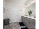 Bathroom featuring a double sink vanity with gray cabinets and a large mirror at 6381 Trinity Crossing Cir, Kannapolis, NC 28081