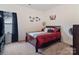 Nicely appointed bedroom features cozy bed, carpet and dark curtains with ample light at 6381 Trinity Crossing Cir, Kannapolis, NC 28081