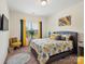 Bright bedroom features a cozy bed, natural light and colorful decor with ample light at 6381 Trinity Crossing Cir, Kannapolis, NC 28081