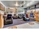 Finished garage with theater chairs, TV, storage and sports-themed decor at 6381 Trinity Crossing Cir, Kannapolis, NC 28081