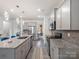 Modern kitchen with stainless steel appliances and granite countertops, ideal for cooking and entertaining at 6381 Trinity Crossing Cir, Kannapolis, NC 28081