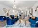 Open concept living room featuring stylish sofas, a glass table, and modern lighting at 6381 Trinity Crossing Cir, Kannapolis, NC 28081