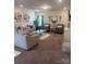 Beautiful living room with neutral walls, plush carpet, stylish decor, and modern furniture at 6381 Trinity Crossing Cir, Kannapolis, NC 28081