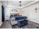 Comfortable main bedroom with neutral tones, stylish decor, and a tray ceiling with modern light fixture at 6381 Trinity Crossing Cir, Kannapolis, NC 28081