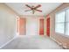 Bedroom with carpet, ceiling fan, and multiple doors at 6573 Weldon Nw Cir # 22, Concord, NC 28027
