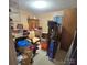 Cluttered bedroom with neutral colored walls at 6573 Weldon Nw Cir # 22, Concord, NC 28027