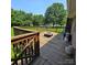 Wooden deck featuring a built-in fire pit, ideal for outdoor gatherings at 6573 Weldon Nw Cir # 22, Concord, NC 28027