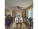 Cozy dining room with ceiling fan, hardwood table, six chairs, and window to the outside at 6573 Weldon Nw Cir # 22, Concord, NC 28027