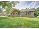 Charming brick ranch-style home with dark shutters and a well-manicured lawn at 6573 Weldon Nw Cir # 22, Concord, NC 28027