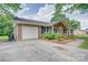 Charming brick home featuring an attached garage, landscaped garden, and a well-maintained driveway at 6573 Weldon Nw Cir # 22, Concord, NC 28027