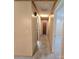 Neutral hallway showcases multiple rooms and tan carpet at 6573 Weldon Nw Cir # 22, Concord, NC 28027
