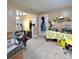 Open kitchen area features tiled flooring, and view through a doorway to the adjacent room at 6573 Weldon Nw Cir # 22, Concord, NC 28027