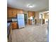 Open kitchen featuring white appliances and tile floor at 6573 Weldon Nw Cir # 22, Concord, NC 28027