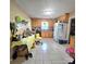 Spacious kitchen with tile flooring, wood cabinets, window, and white refrigerator at 6573 Weldon Nw Cir # 22, Concord, NC 28027