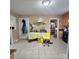 Large kitchen with tile floors, overhead lighting, access to other living spaces, and white appliances at 6573 Weldon Nw Cir # 22, Concord, NC 28027