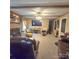 Comfortable living room with a brick fireplace, flat screen TV and exposed beam ceiling at 6573 Weldon Nw Cir # 22, Concord, NC 28027