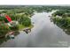 Scenic aerial view of the lakefront property, nestled among trees and offering stunning water access at 7455 Ivey Dr, Sherrills Ford, NC 28673