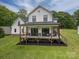 Expansive back porch with seating, perfect for outdoor relaxation and entertaining at 7455 Ivey Dr, Sherrills Ford, NC 28673