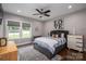 Comfortable bedroom with a large window, soft lighting, and stylish furnishings at 7455 Ivey Dr, Sherrills Ford, NC 28673