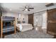 Bedroom featuring bunk beds, barn door, and hardwood floors providing a cozy living space at 7455 Ivey Dr, Sherrills Ford, NC 28673