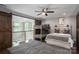 Bedroom featuring barn door, hardwood floors, and a bed providing a cozy living space at 7455 Ivey Dr, Sherrills Ford, NC 28673