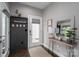 Welcoming entryway with stylish decor, a decorative mirror, coat rack, and a view of the front door at 7455 Ivey Dr, Sherrills Ford, NC 28673