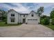 Stunning exterior view of a modern farmhouse-style home with white siding and a well-manicured lawn and a large driveway at 7455 Ivey Dr, Sherrills Ford, NC 28673