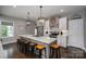 Spacious kitchen with marble countertops, stainless steel appliances, modern fixtures, and ample seating at the large center island at 7455 Ivey Dr, Sherrills Ford, NC 28673