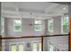 Bright living room with coffered ceilings, modern lighting and an abundance of windows providing views at 7455 Ivey Dr, Sherrills Ford, NC 28673
