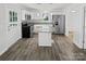 Modern kitchen featuring stainless steel appliances, granite countertops, and a center island at 905 Brookdale St, Kannapolis, NC 28083