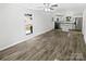 Open concept living area with views of kitchen, featuring hardwood floors and natural light at 905 Brookdale St, Kannapolis, NC 28083