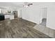 Spacious living area flows into the kitchen, featuring wood flooring and ample natural light at 905 Brookdale St, Kannapolis, NC 28083