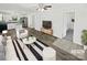Bright, open concept living area with modern furnishings and seamless flow to the kitchen at 905 Brookdale St, Kannapolis, NC 28083