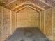 The shed features wood on the walls and ceiling, and a concrete floor at 905 Brookdale St, Kannapolis, NC 28083