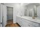 Bathroom features double sink vanity with white cabinetry, drawers, and quartz countertops at 908 Westminster Dr, Statesville, NC 28677