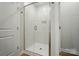 Bathroom offers a glass enclosed shower with tiled walls and chrome fixtures at 908 Westminster Dr, Statesville, NC 28677
