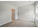 Comfortable bedroom features neutral walls, carpet, and white doors creating a serene atmosphere at 908 Westminster Dr, Statesville, NC 28677