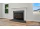 Living room fireplace with wood flooring, perfect for adding warmth and style to any home at 908 Westminster Dr, Statesville, NC 28677